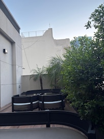 Outside smoking area of the hotel ( very clean and well maintained)