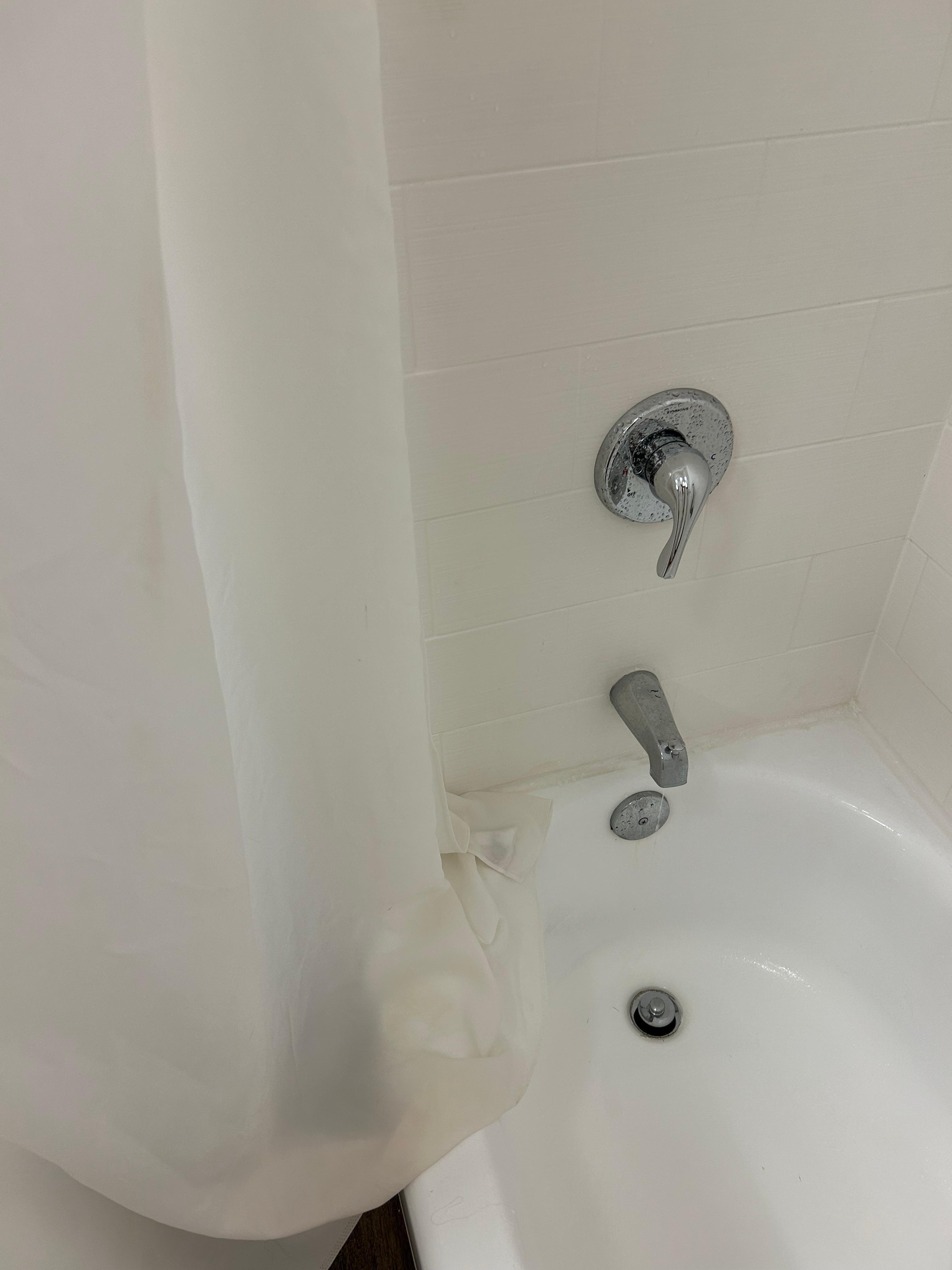 Faucet dripped all night and stains on the shower curtain
