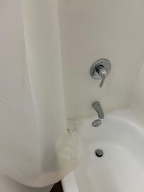 Faucet dripped all night and stains on the shower curtain
