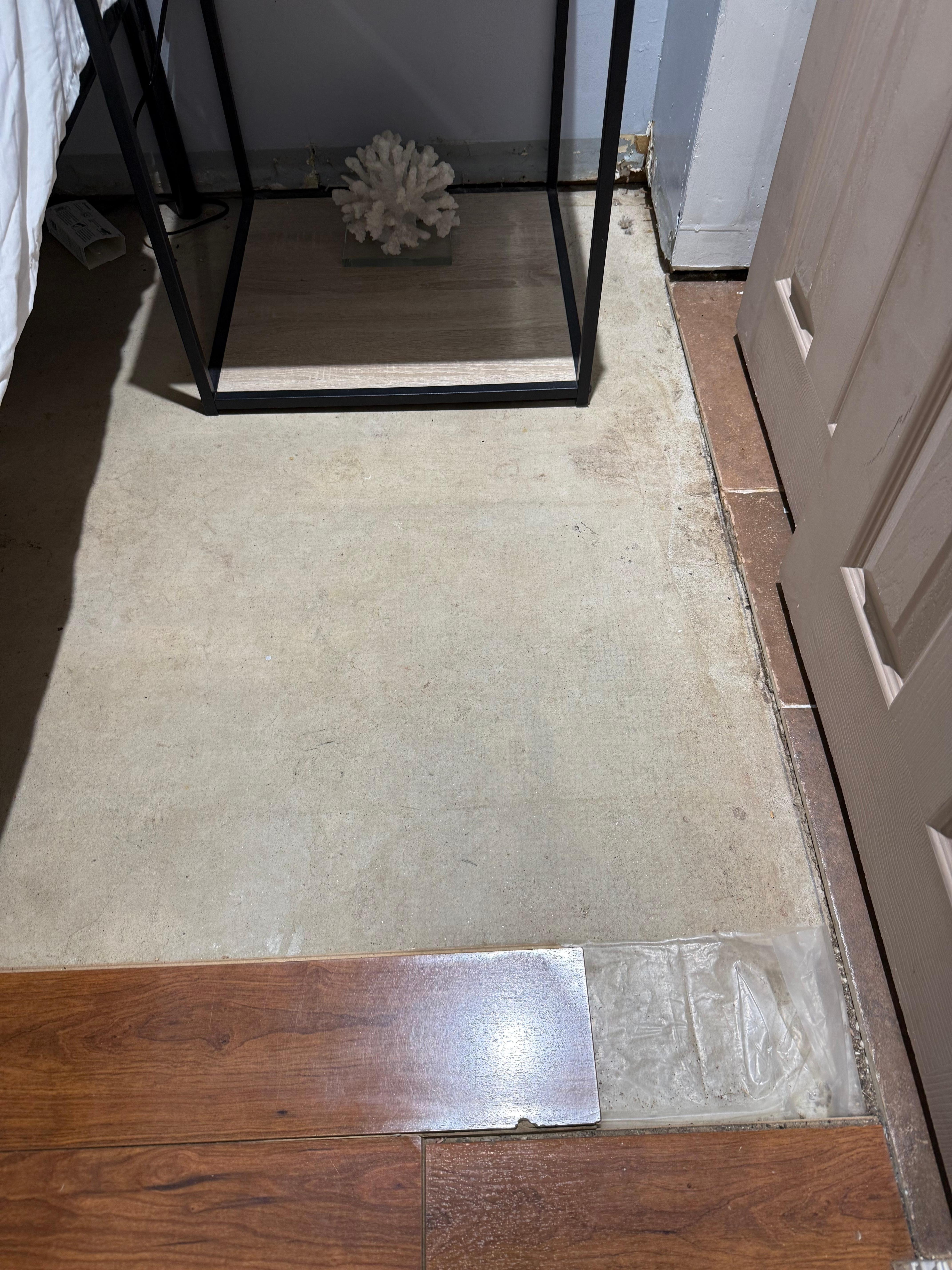 Flooring missing, unfinished downstairs bedroom