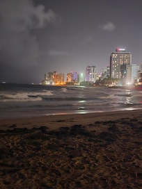 View at night from Condado Beach. Stella Maris Condos, right in front of the Marriott Resort