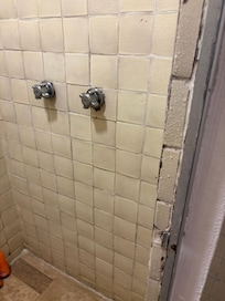 Broken tiles in the shower