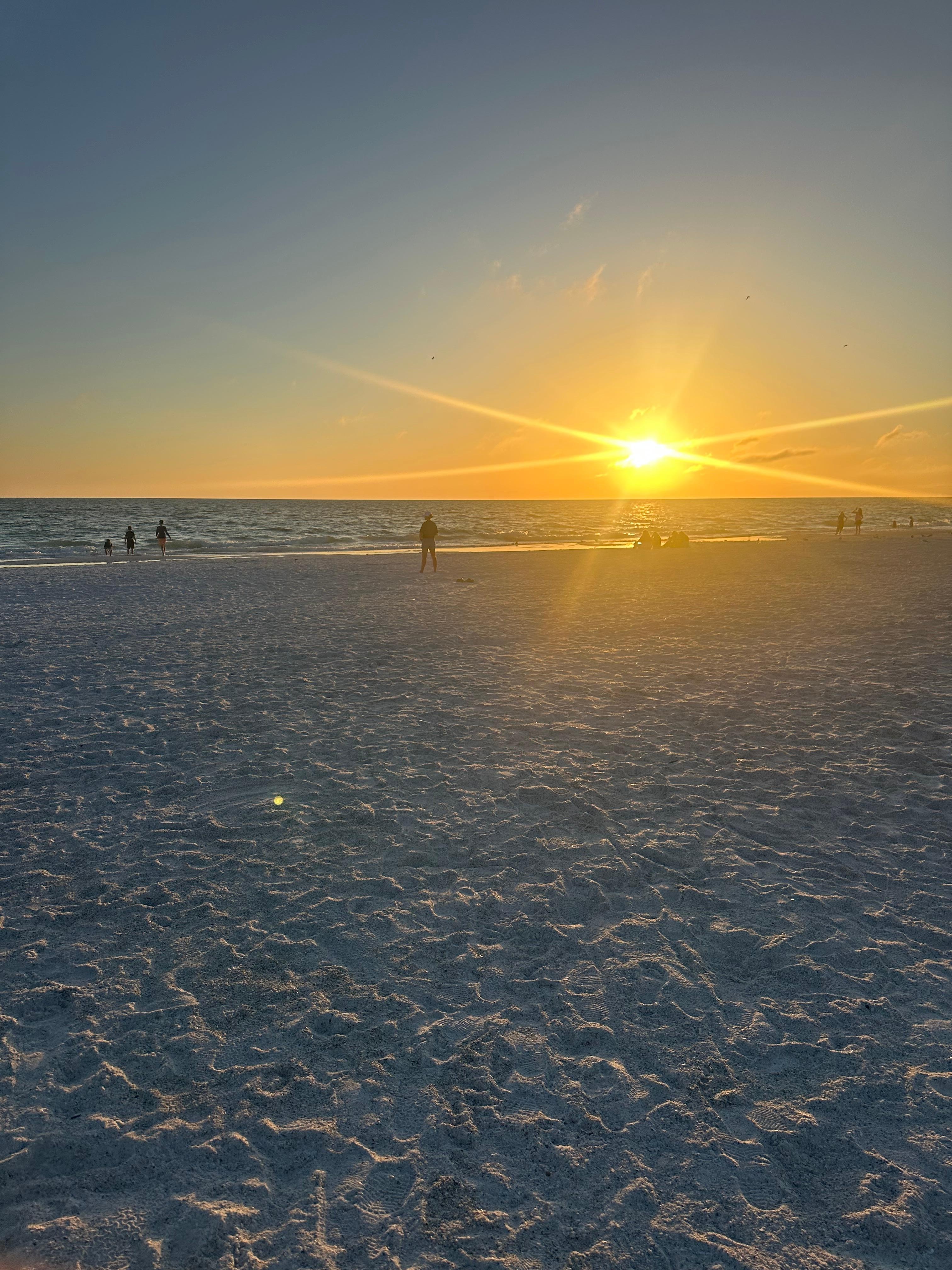 Sunset at the beach across the street. 