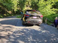 Upper parking area that is right next to the road as you come around a hairpin turn at the top of the hill