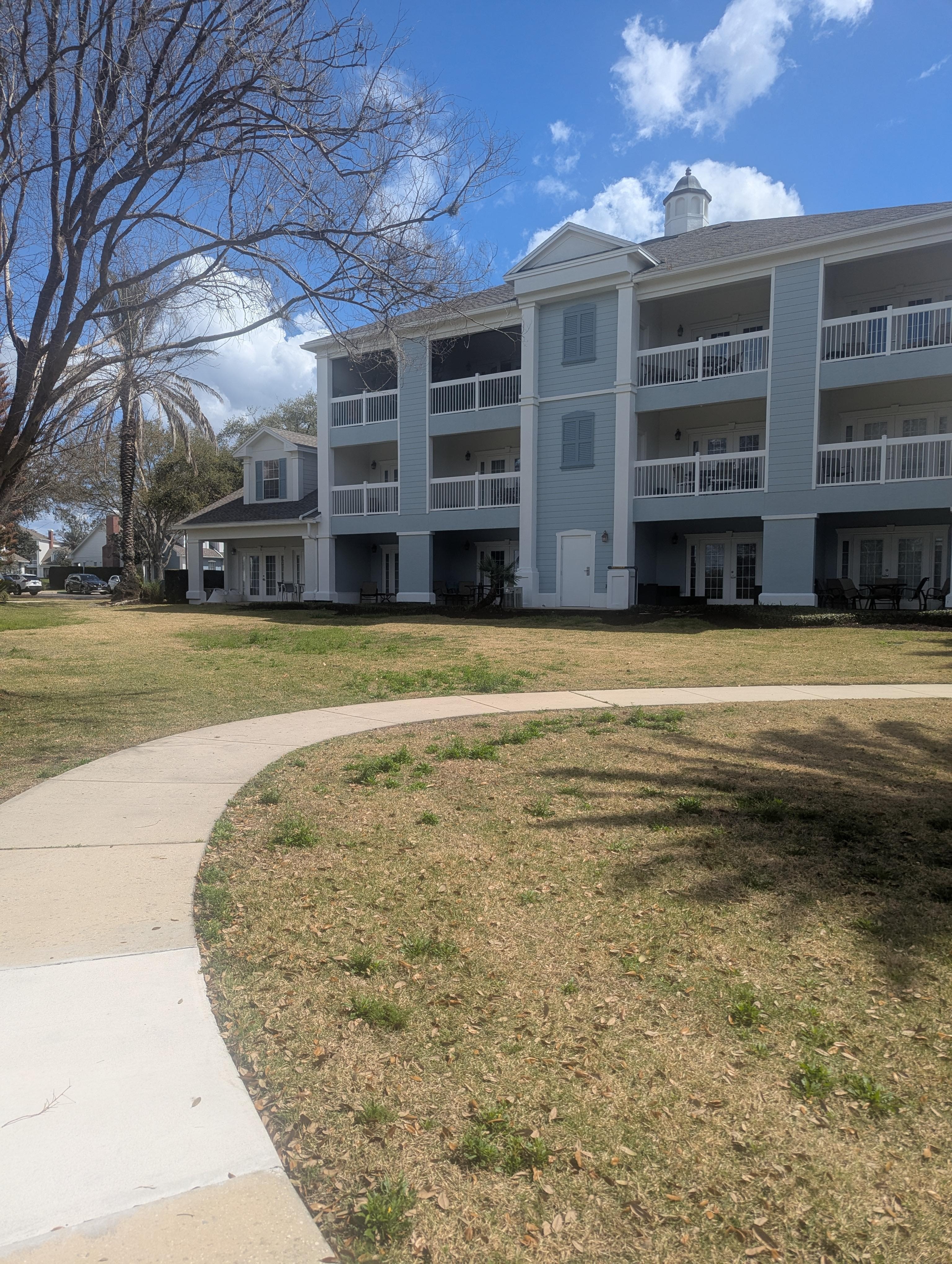 Far left of building with large patio.