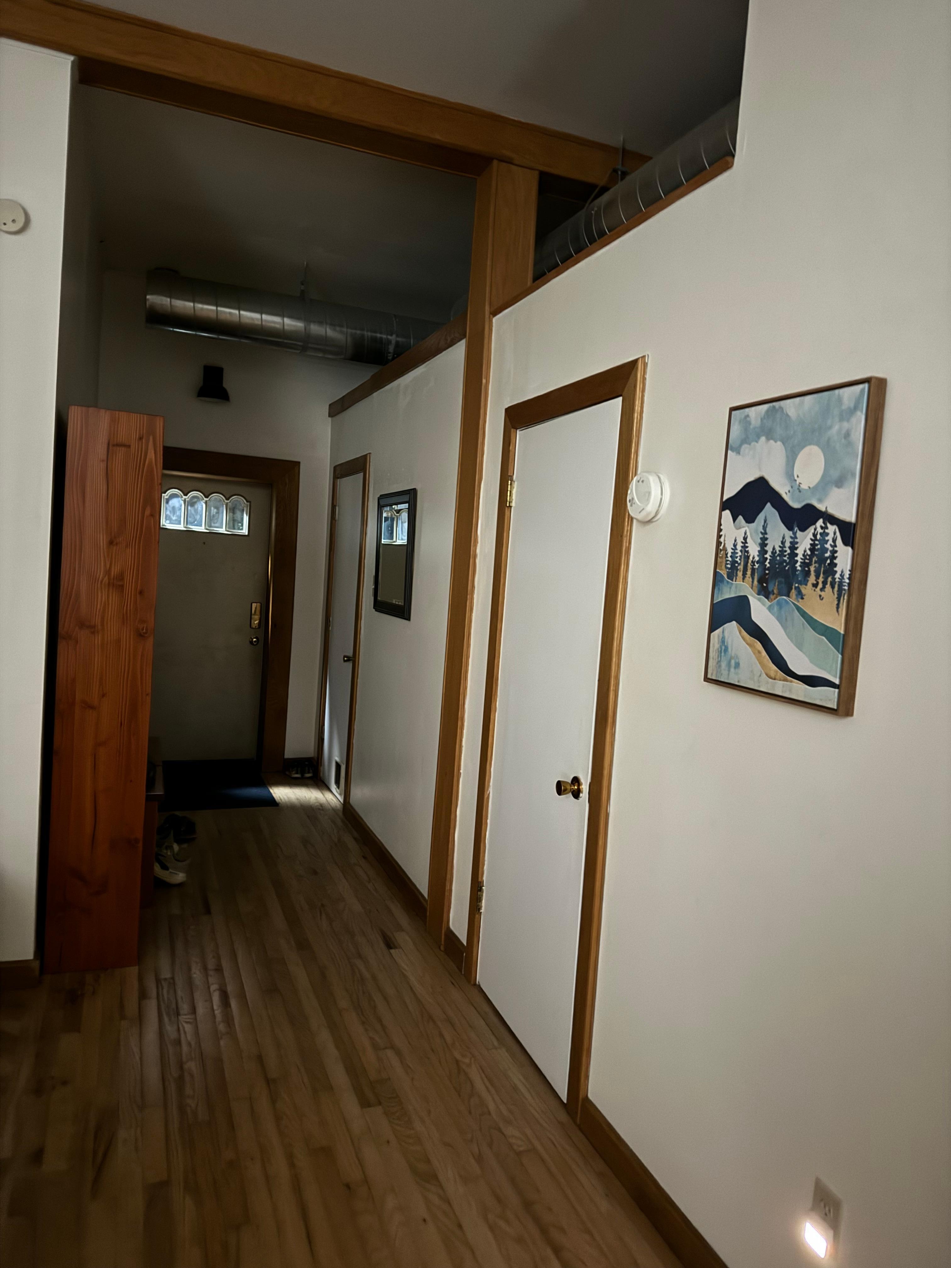 Room wall open at the top to main living space