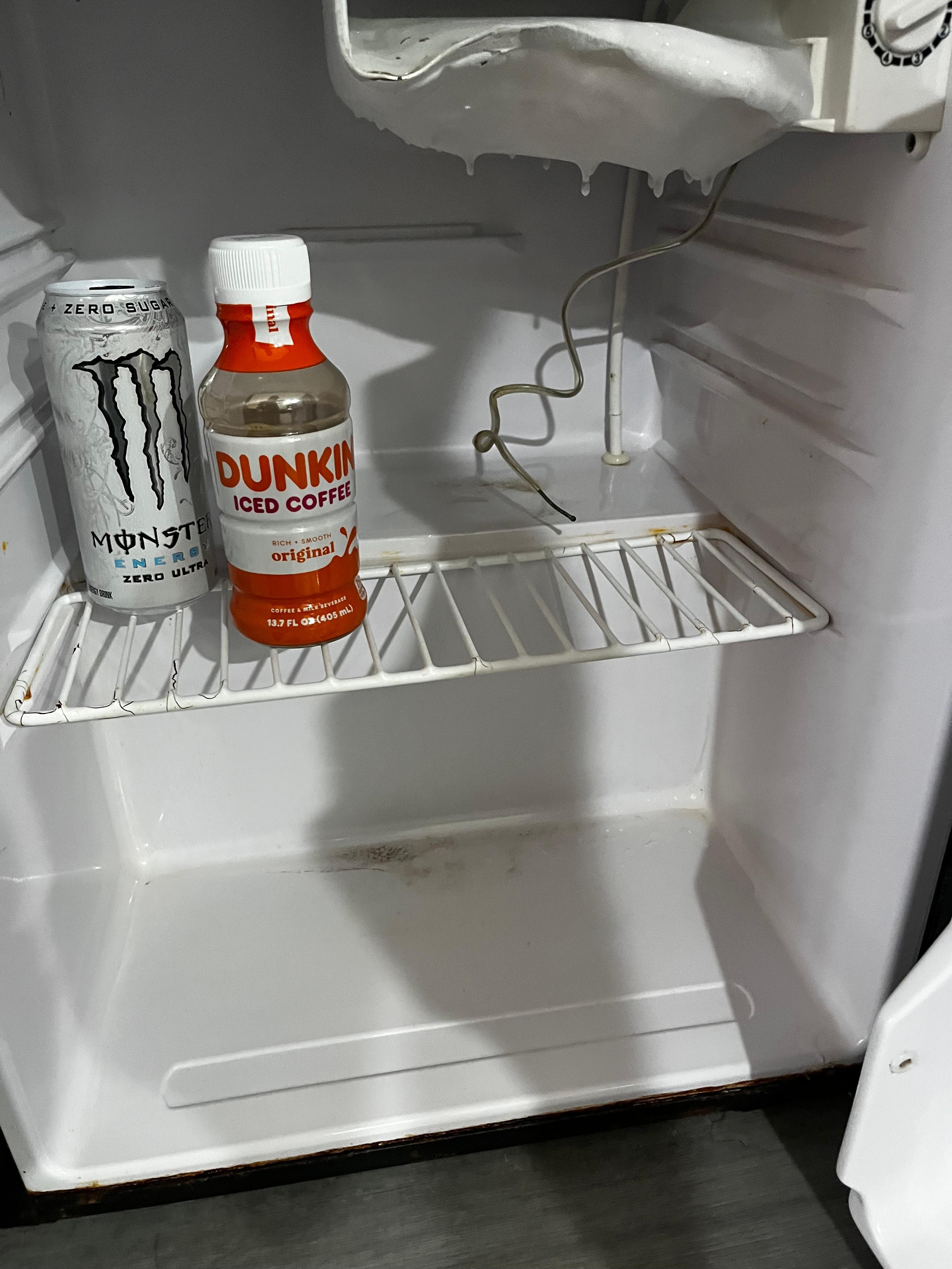 Exposed wiring in the dirty refrigerator