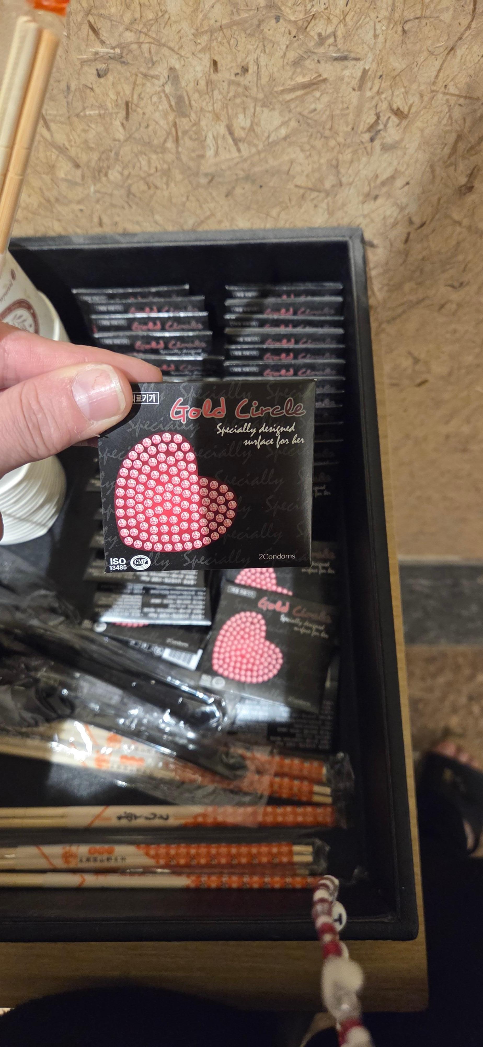 Condoms provided in the hallway next to the microwave.