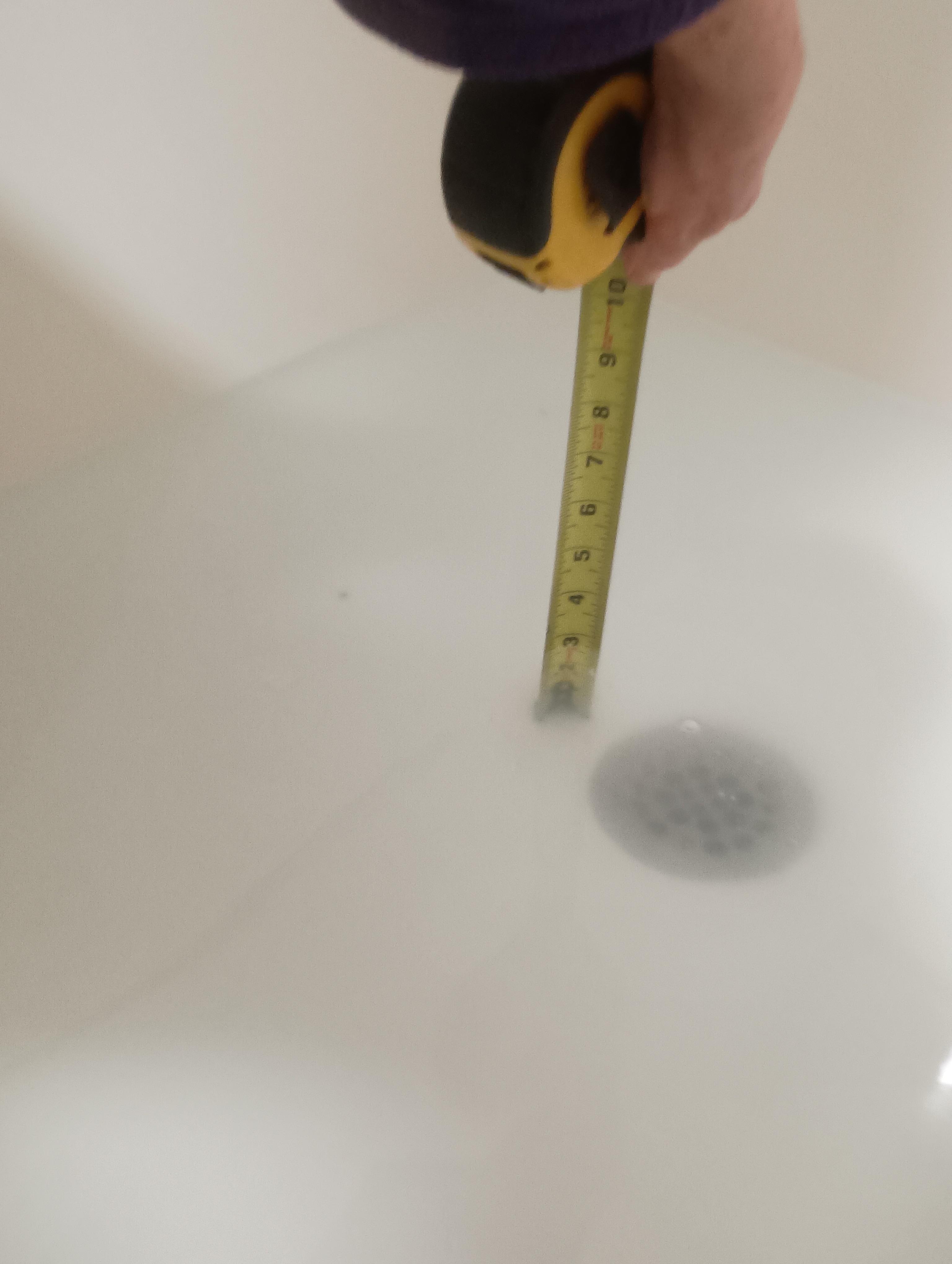 Water standing in shower pan. 
