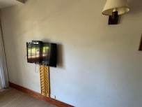 This is the TINY TV if you can even see it. Not even located in front of the sofa.