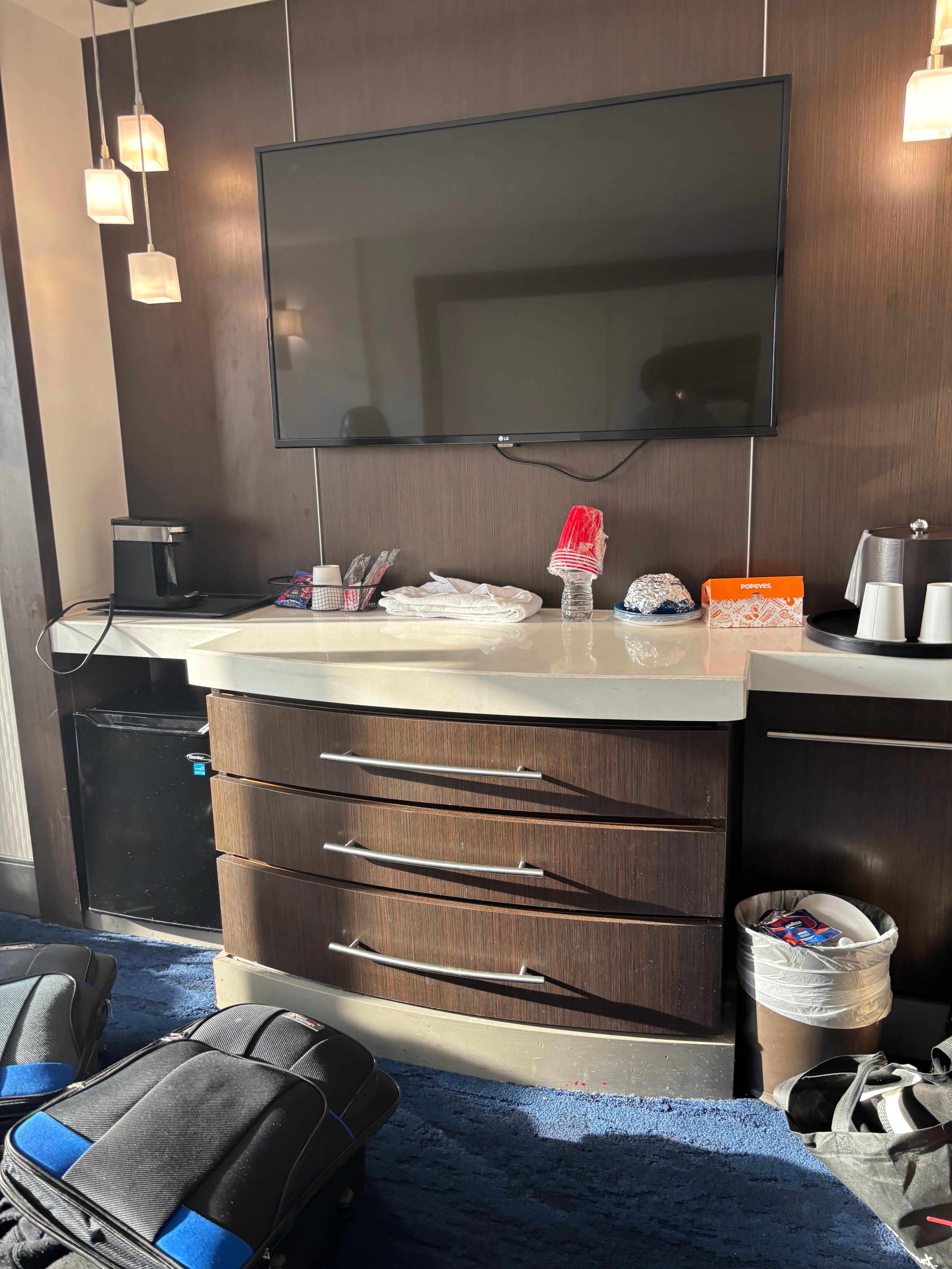 Tv area spacious and clean with a mini fridge and coffee pot