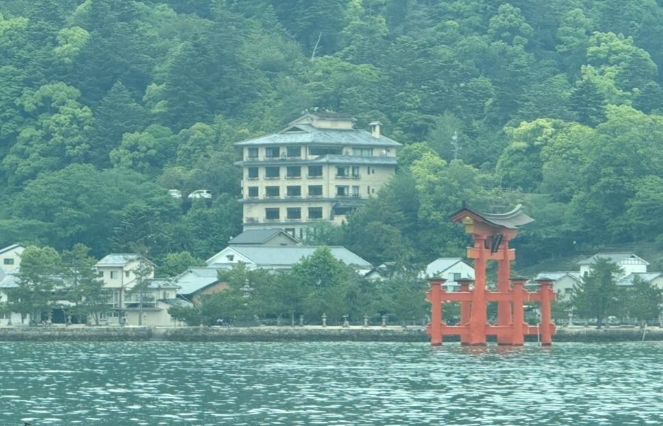 View of the Jukeiso 4-story hotel and the Torii from the ferry.