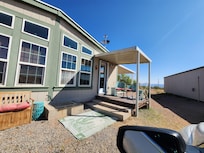 This is the key coded front door that doesn't present itself until you drive around the main house on the right side.