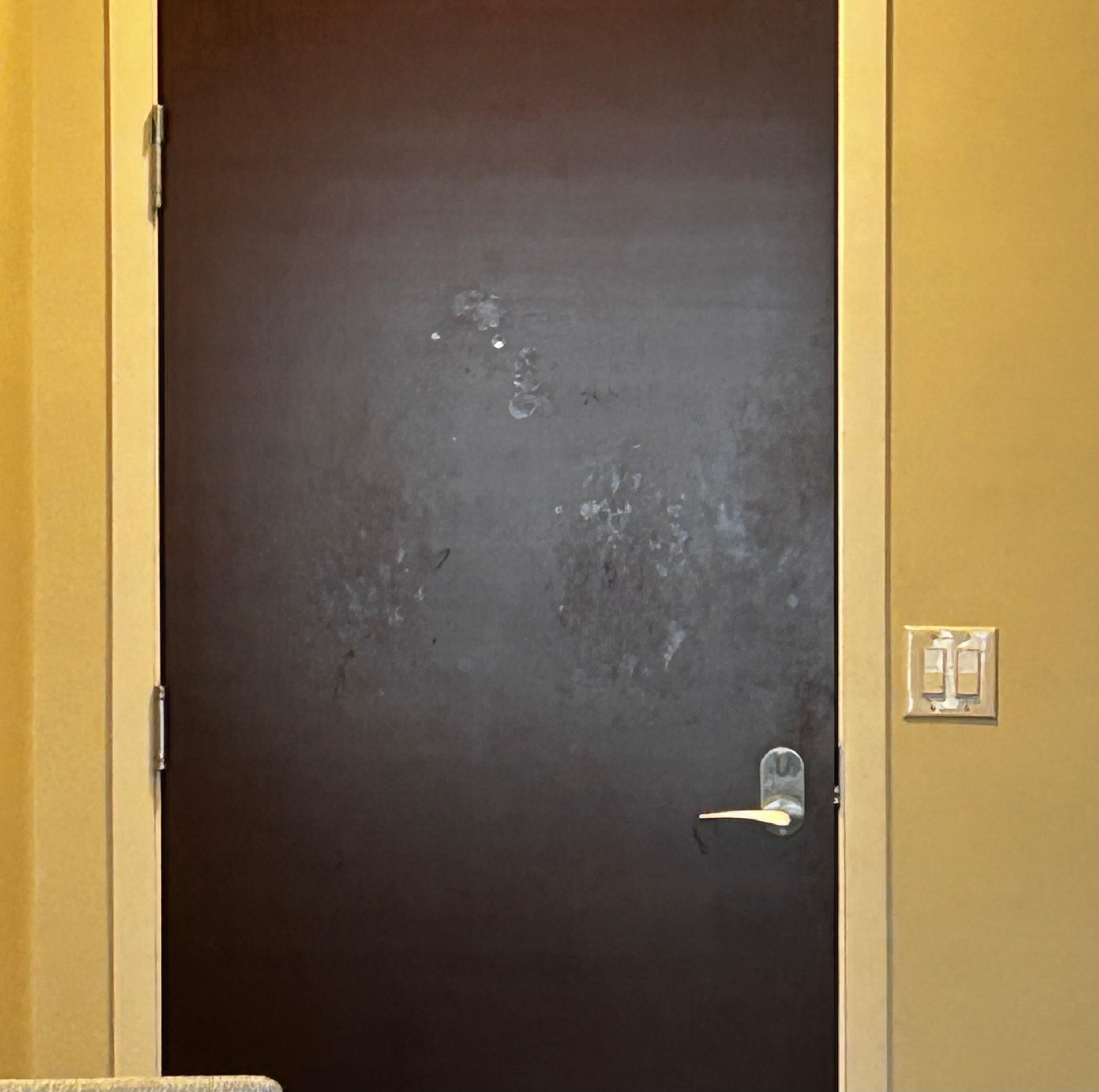 Greasy finger prints on door