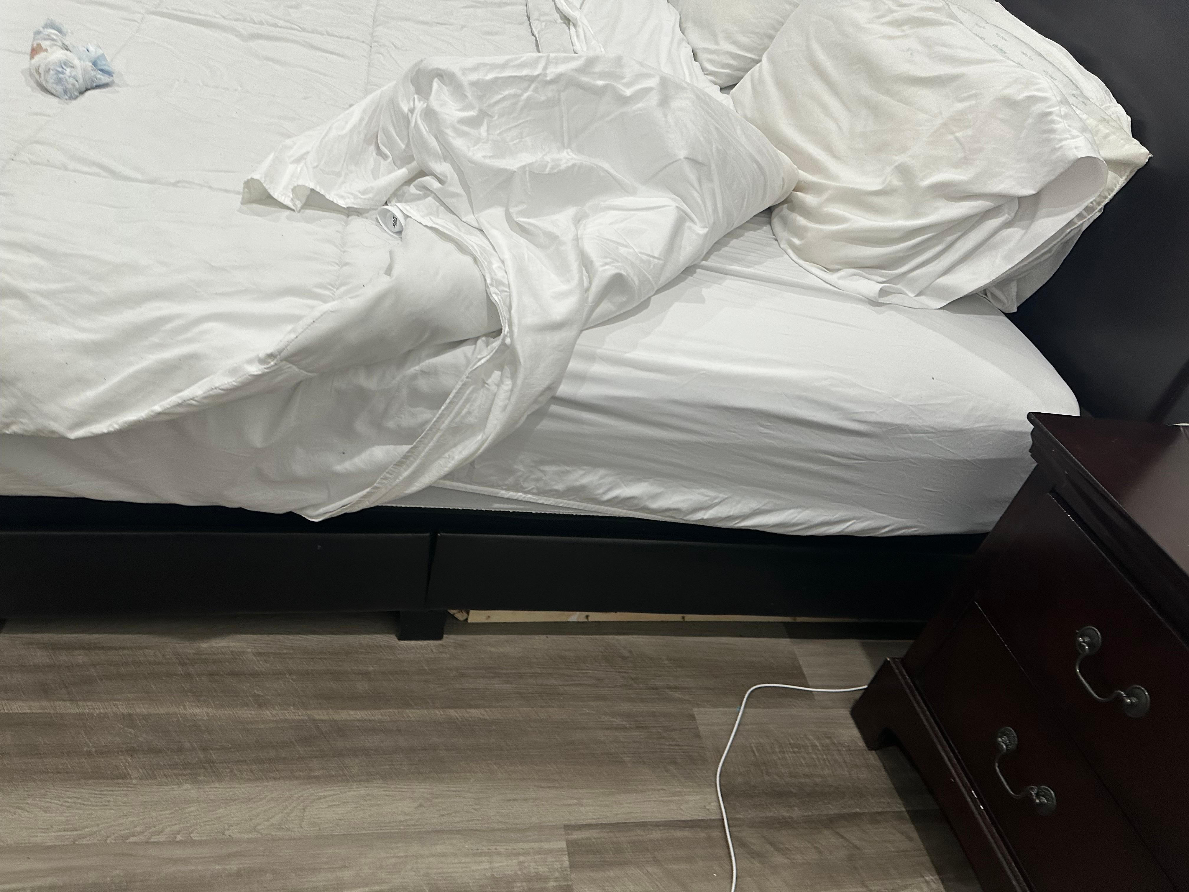 Broken bed leaning  on one side 