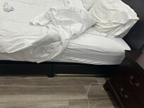 Broken bed leaning on one side