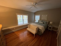 Spacious living room, there is a large walk-in closet to the right with plenty of hanging space and two luggage racks for suitcases.