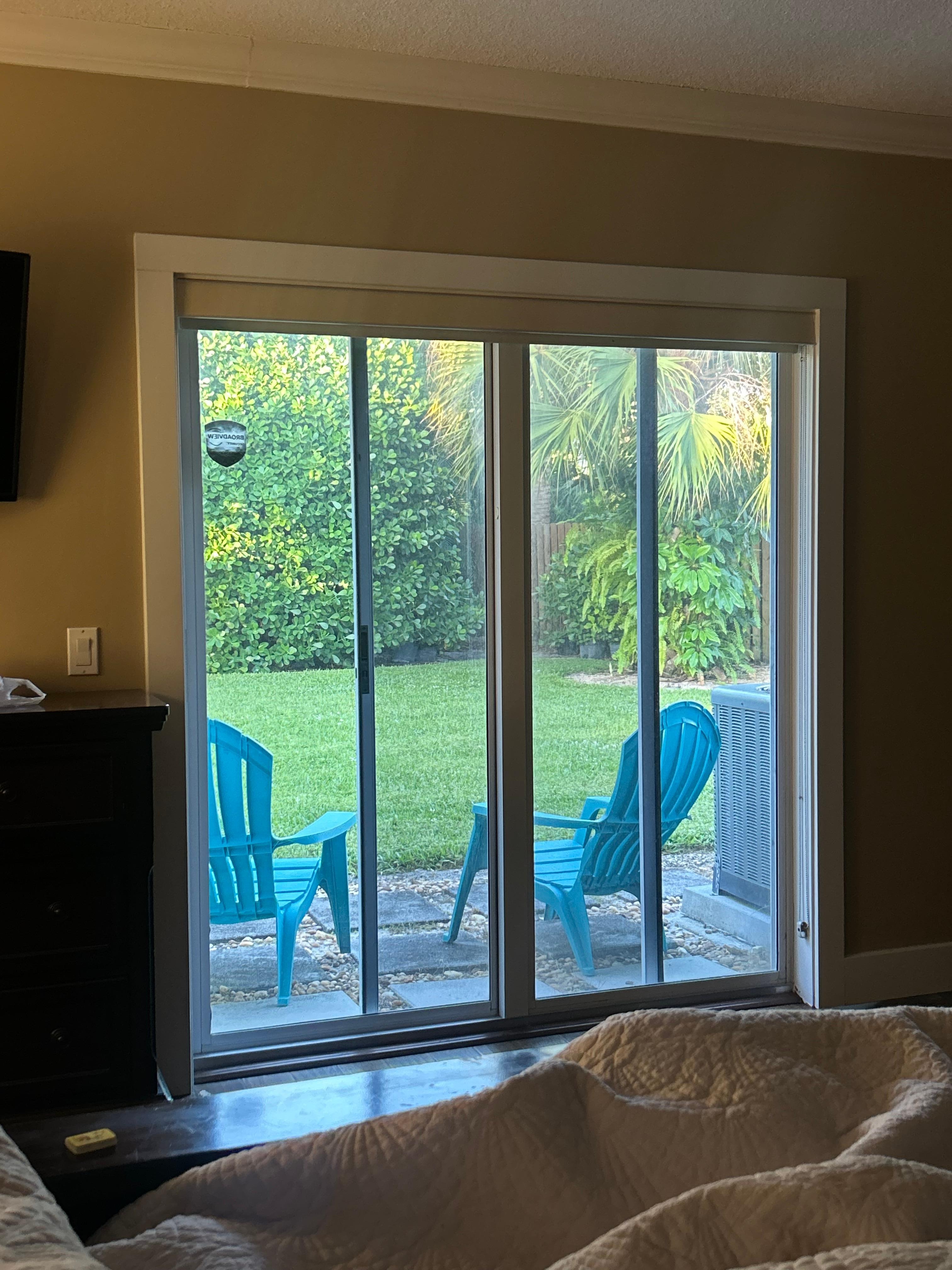 View from master bedroom to side yard which is 