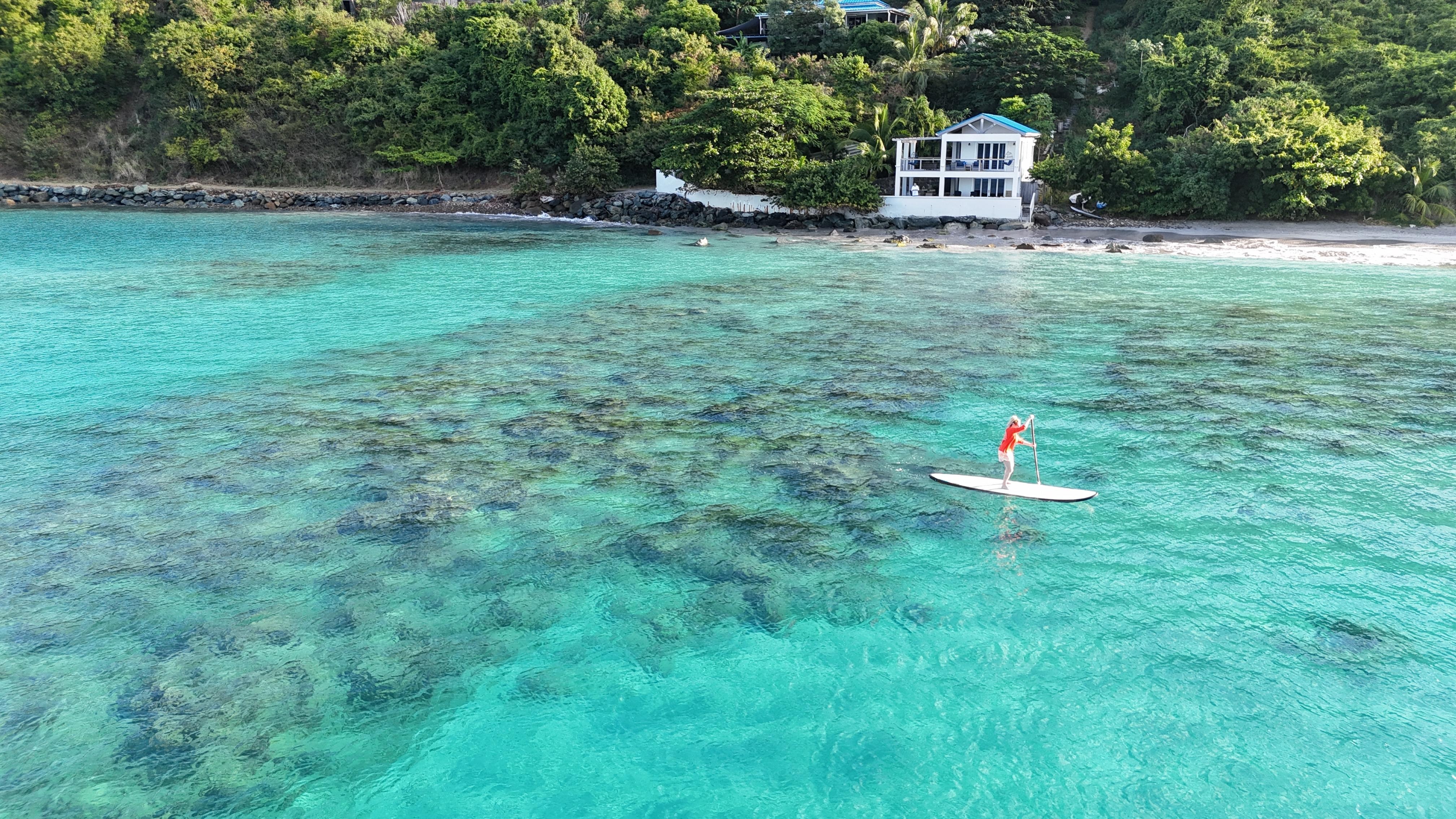 Paddleboarding in front of the Brewer's Bay Beach House!