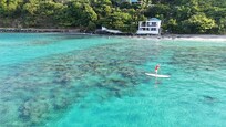 Paddleboarding in front of the Brewer's Bay Beach House!