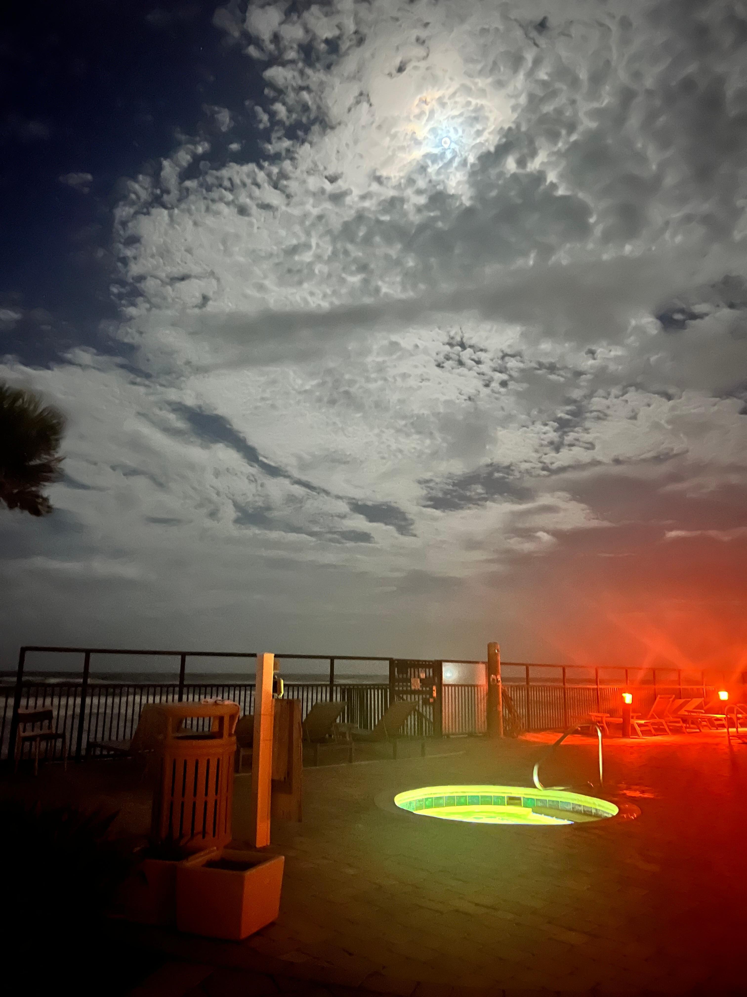 Pool and hot tub at night 