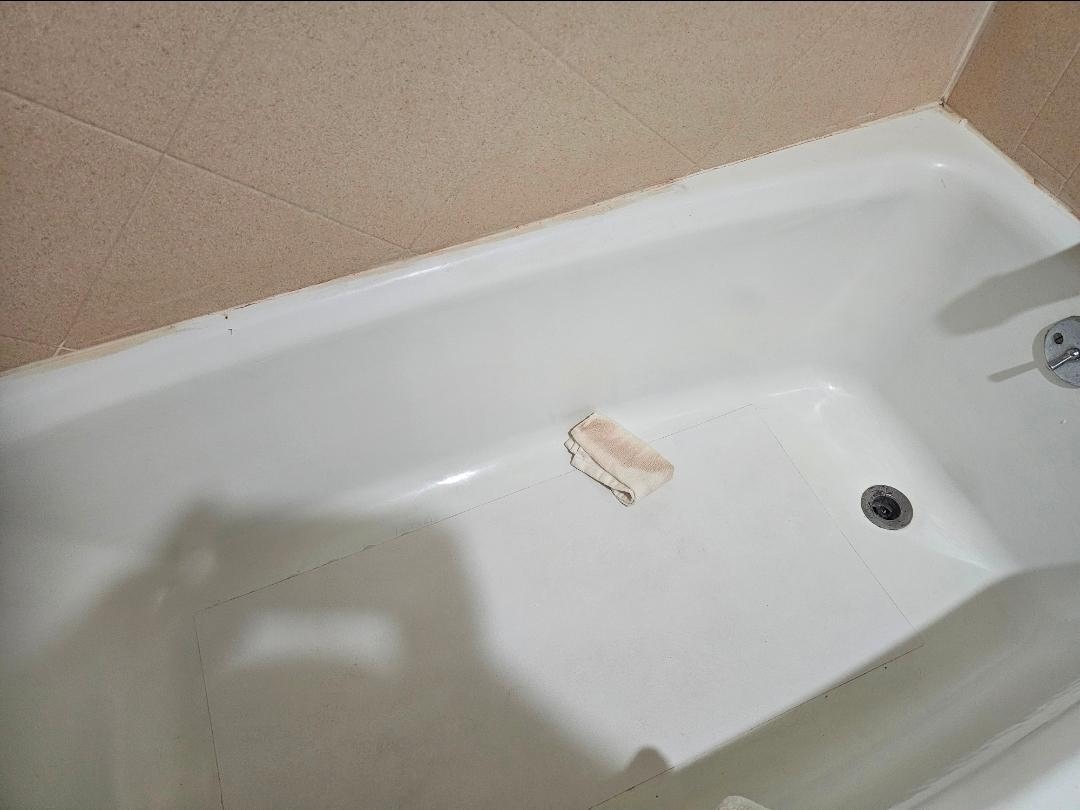 Dirty washcloth left in the tub.