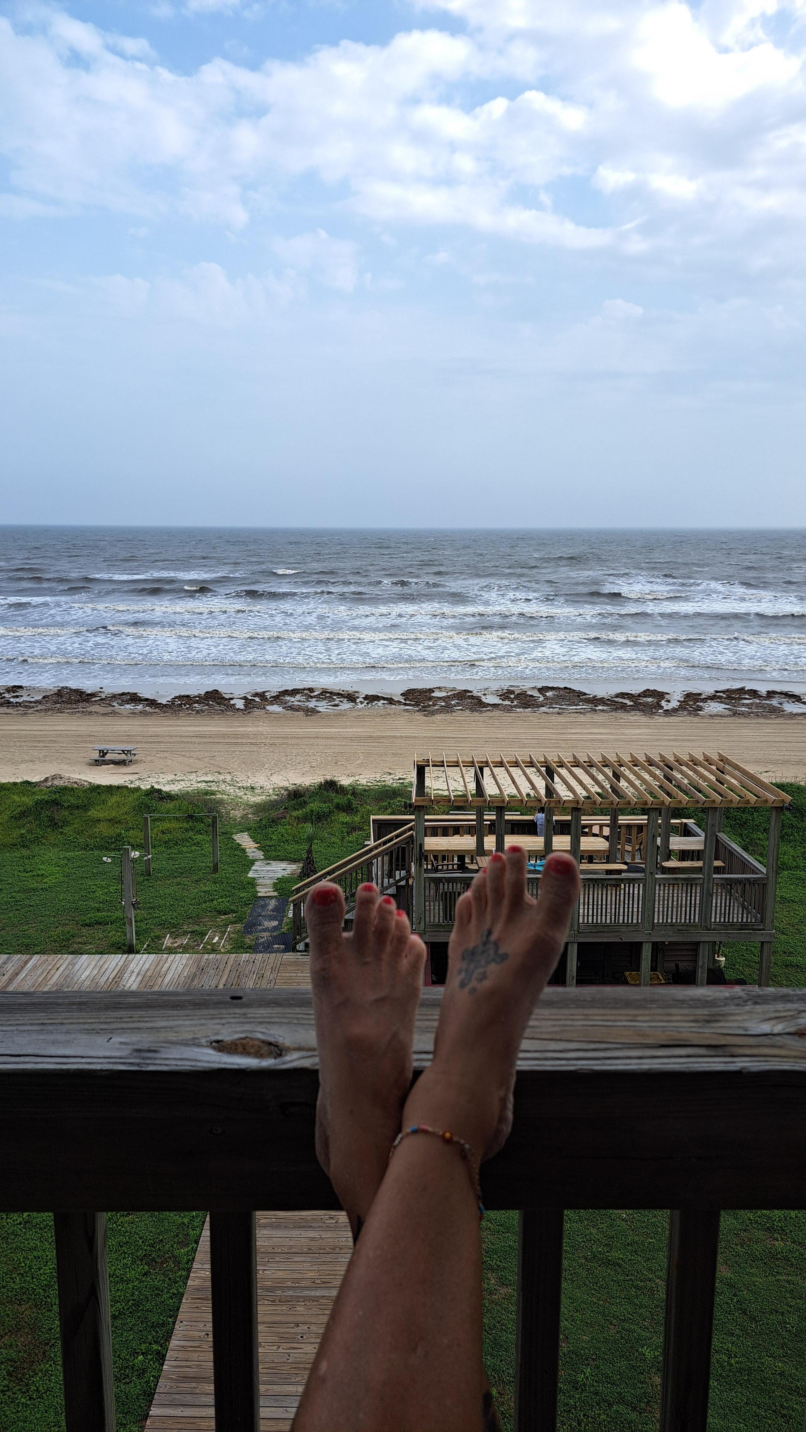Sitting on balcony looking out.. You can see the cooking / relaxing area by my feet 
