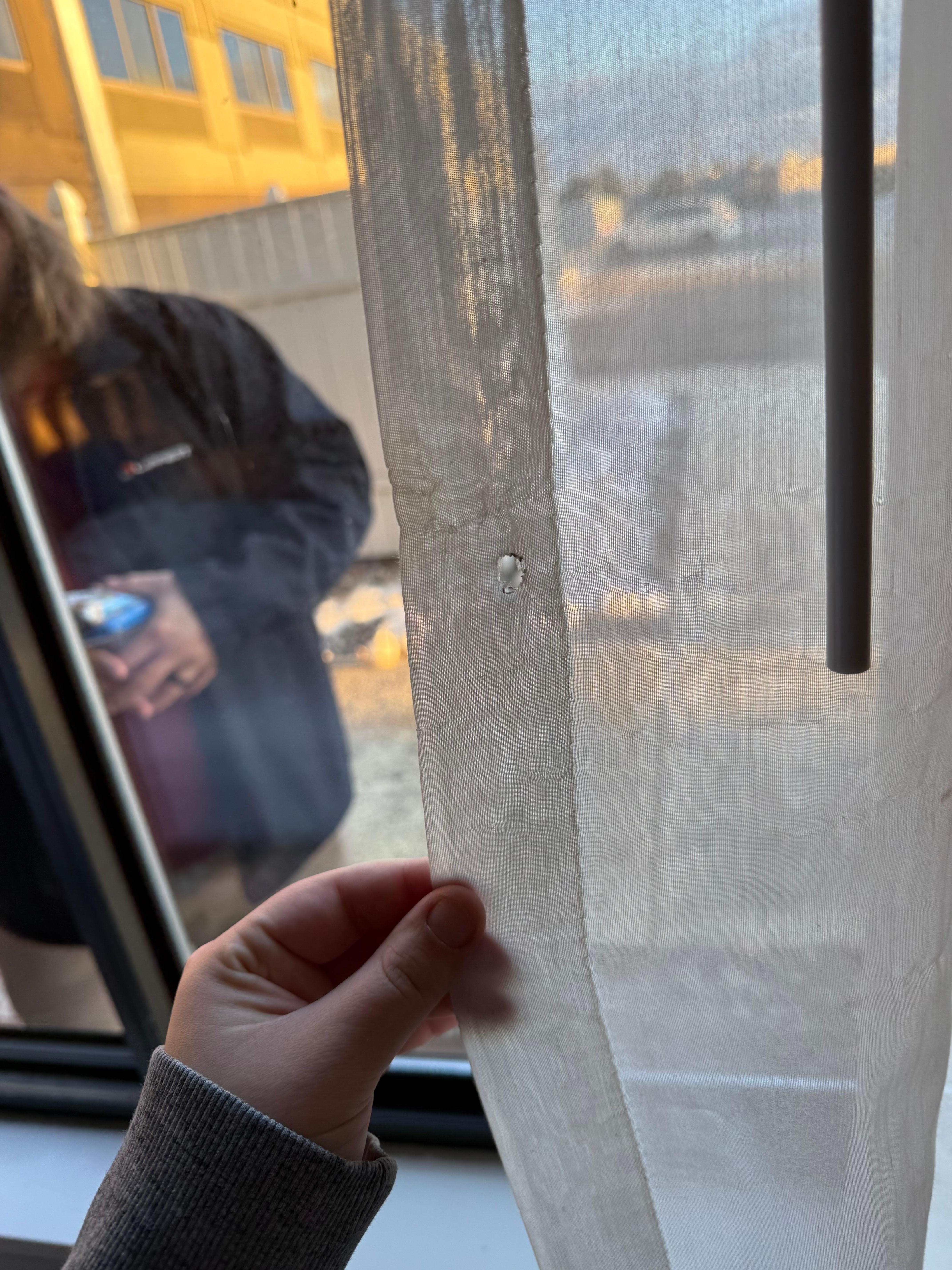 Cigarette burn in curtain