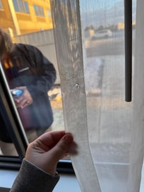 Cigarette burn in curtain