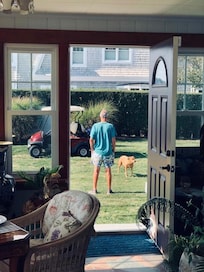 Opened porch door for breeze : then his two unleashed dogs ran into and through out the home.