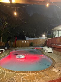 Pool and hot tub at night