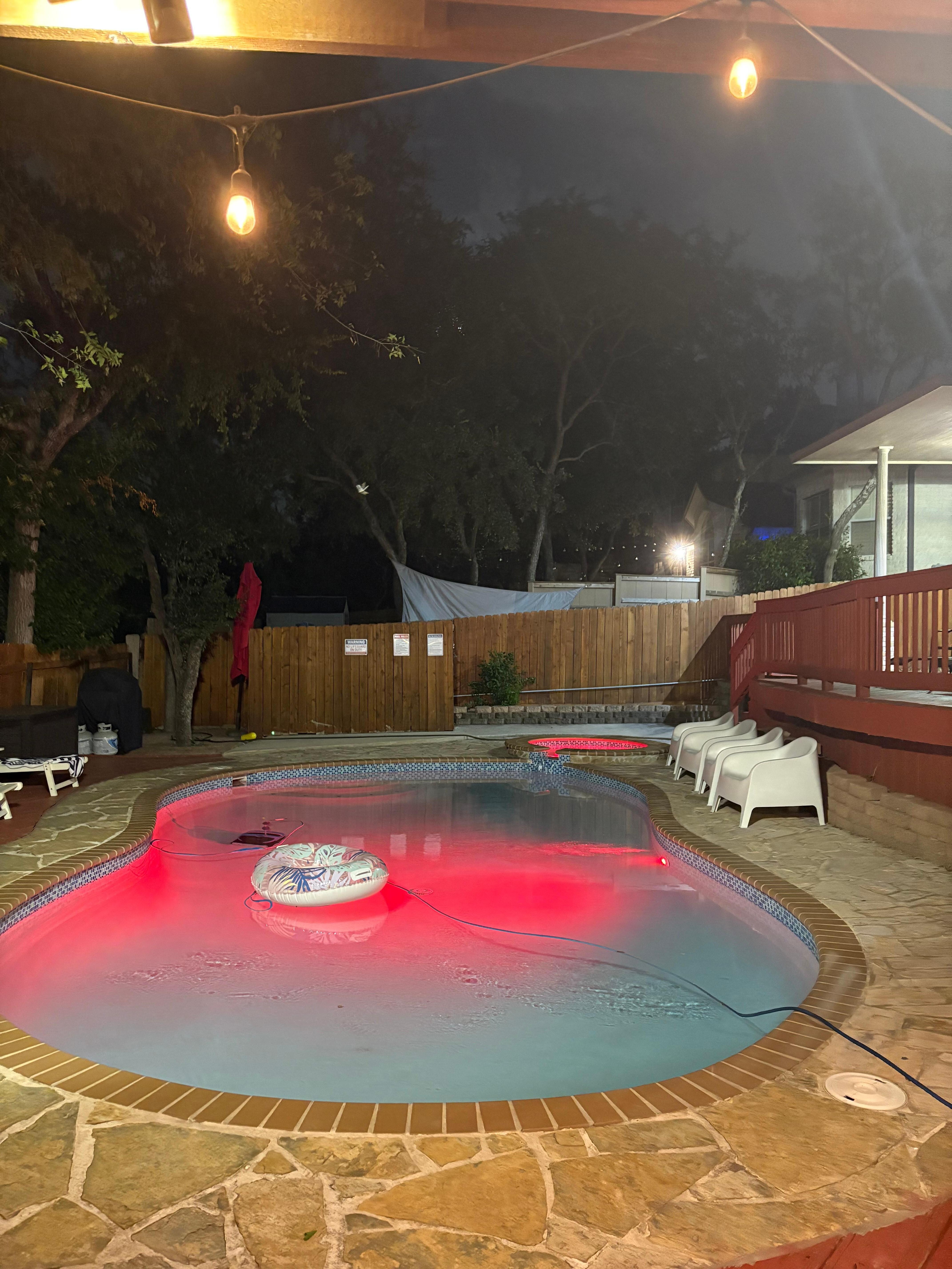 Pool and hot tub at night