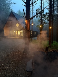 The Carpenters Cabin at Dusk putting out the fire