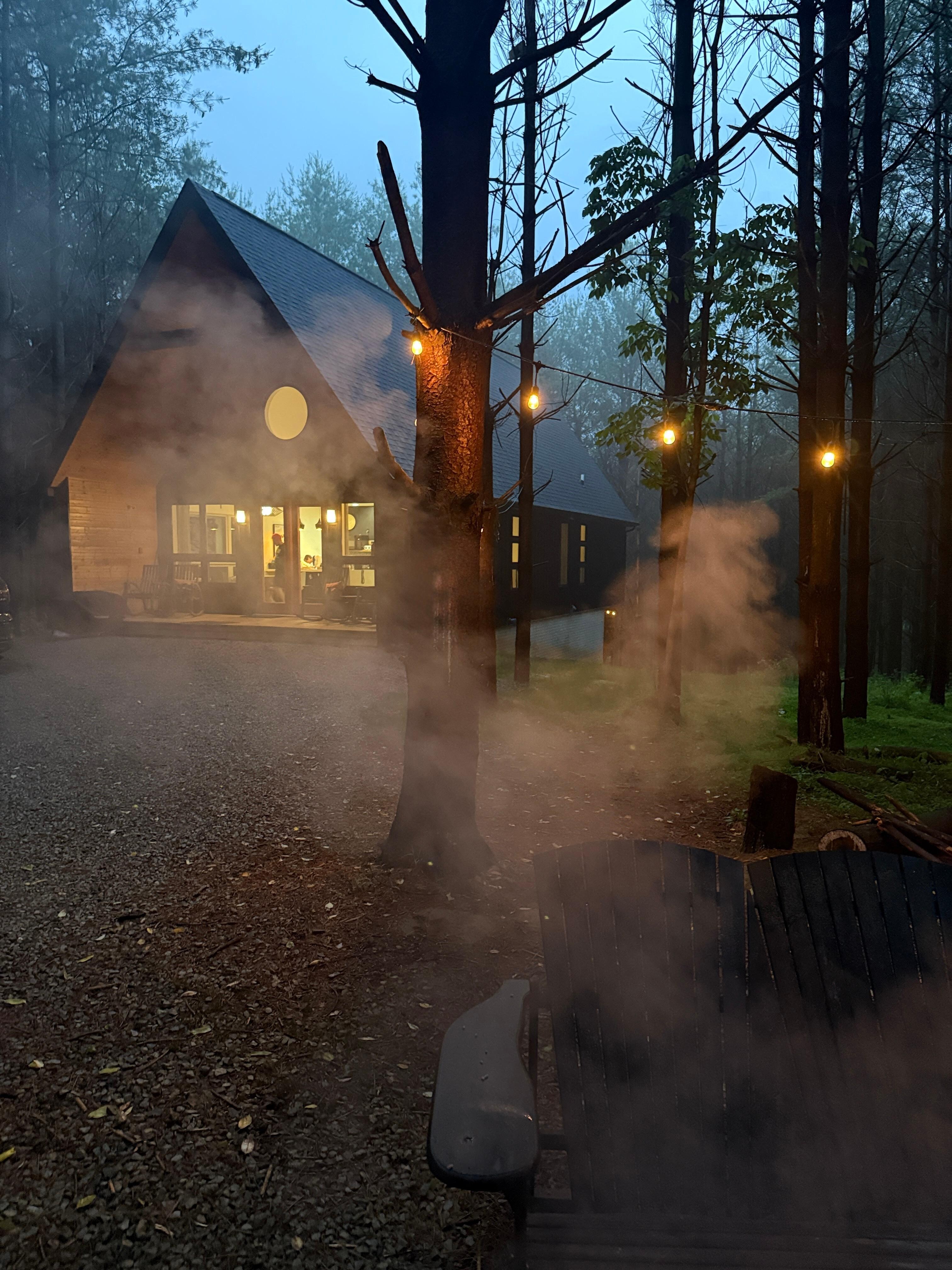 The Carpenters Cabin at Dusk putting out the fire