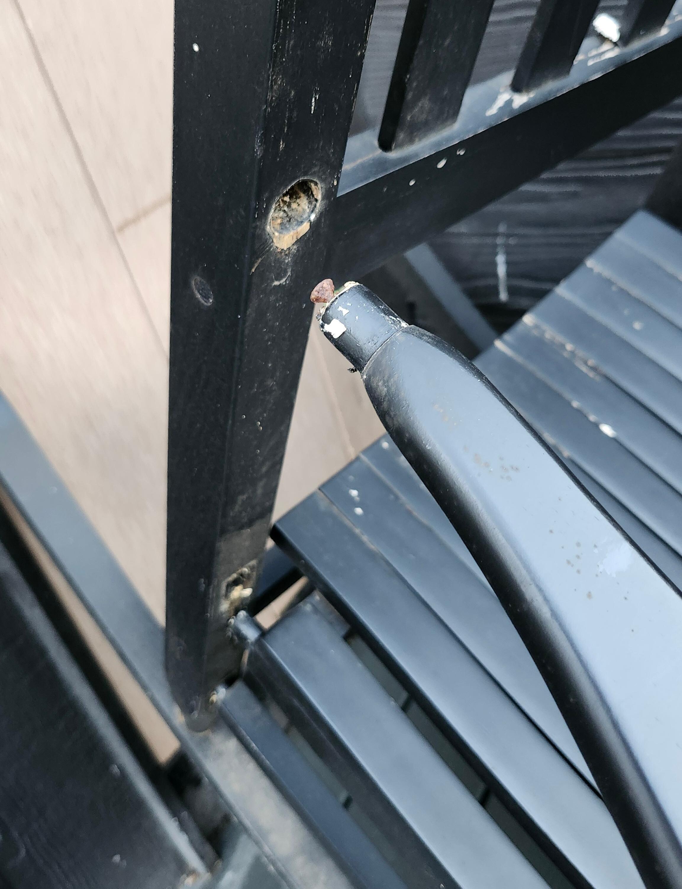 One broken chair on rear deck