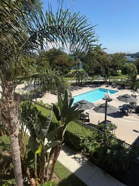 Pool area view from room … walking trail behind pool area ,,, nice bridge .