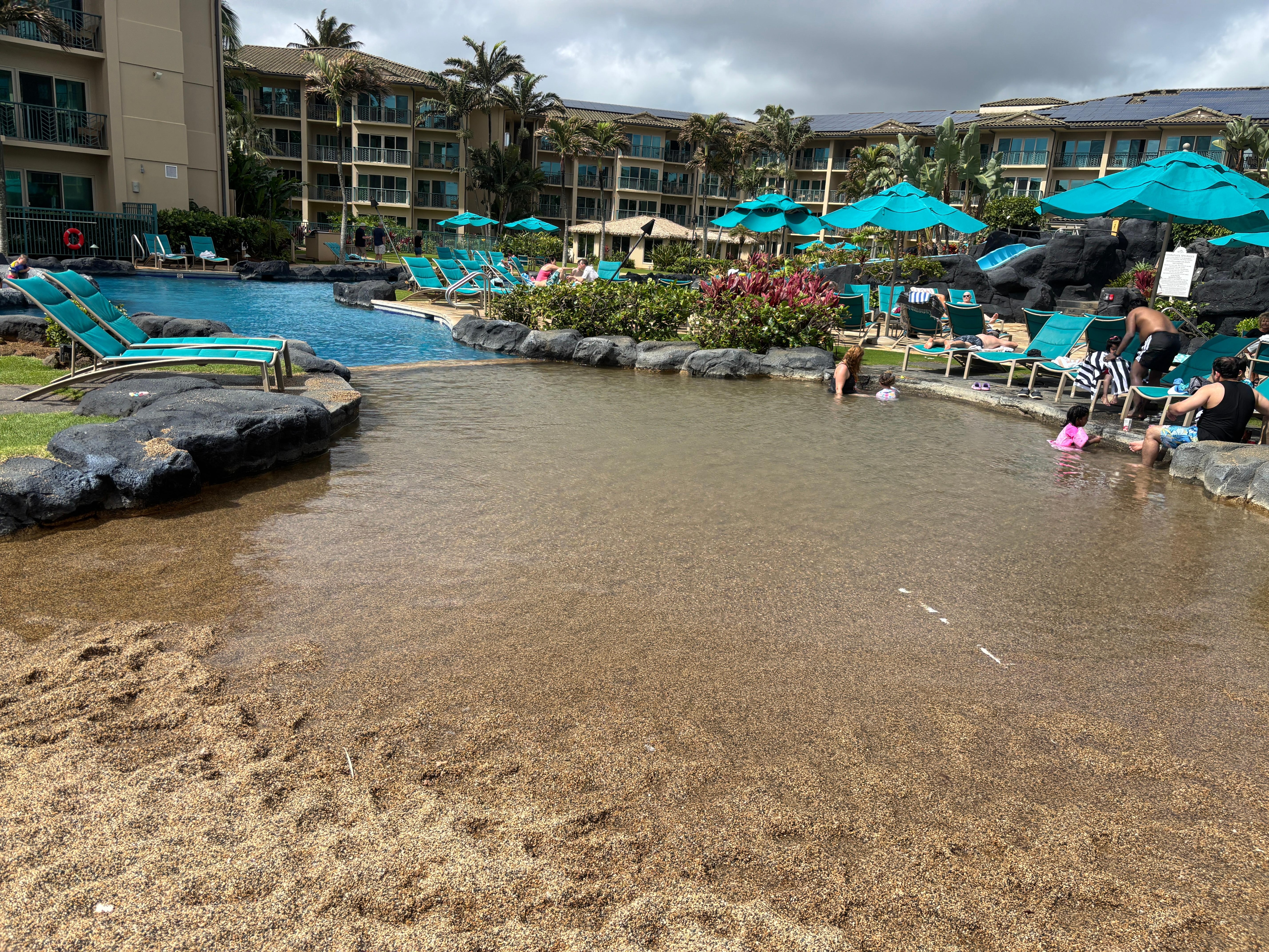 Pool even has a sloped shallow sand section which was loved by toddlers and young kids.  