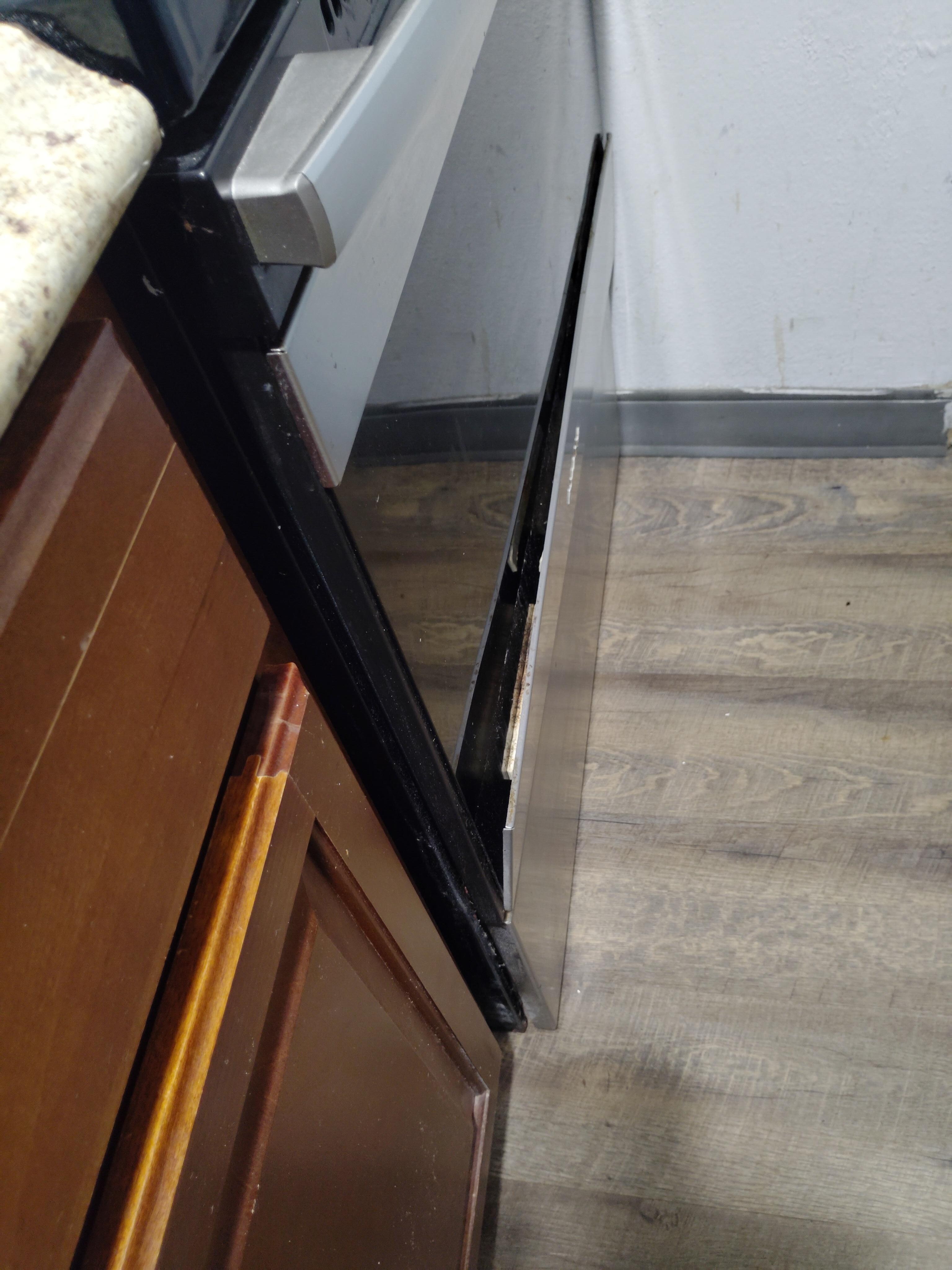 Trim panel broken loose from oven door