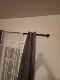 Curtain rod pulled out of rod prior to our arrival