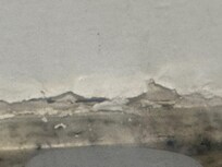 in the bathroom located on wall above the sink