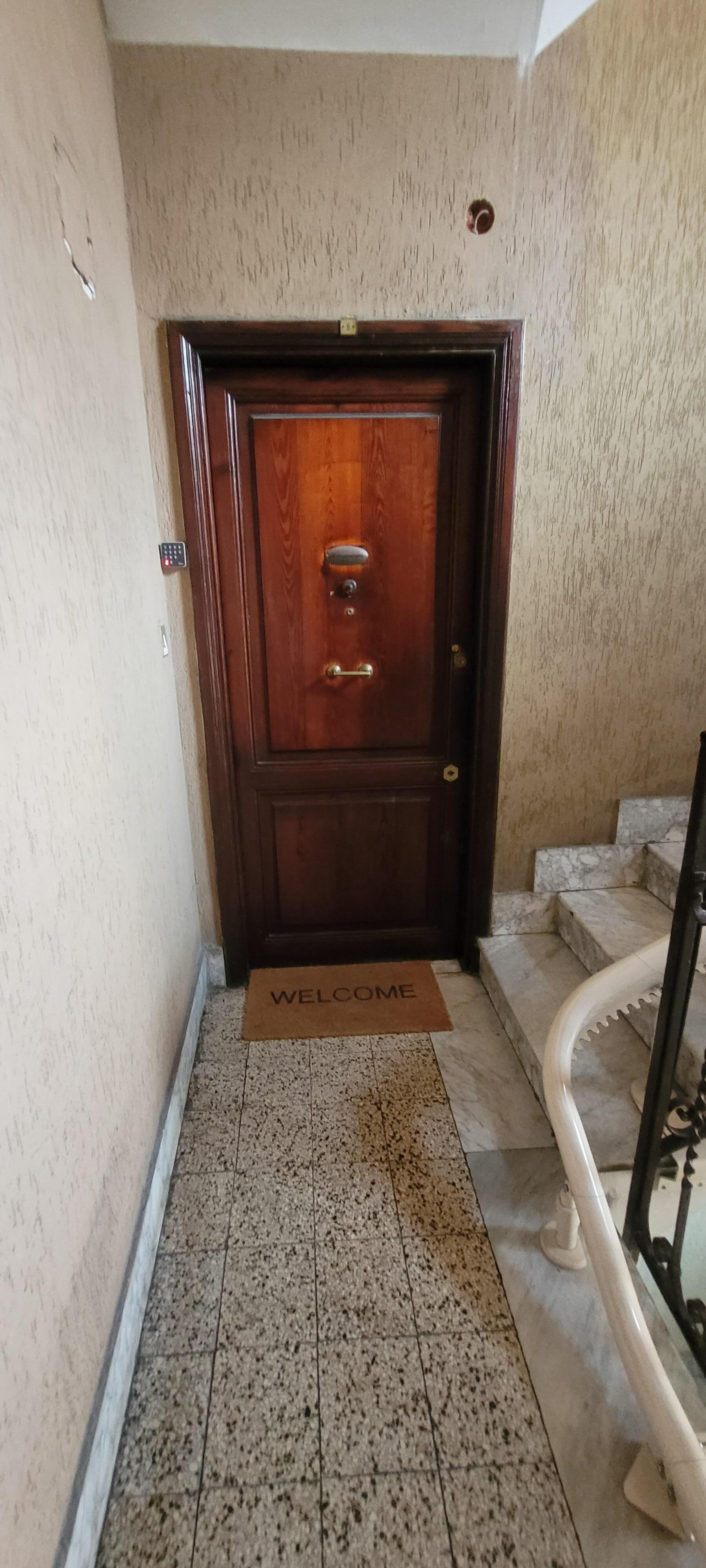 The front door to apartment on 1st floor (US: 2nd floor). The keypad was very easy to use. Just follow check-in instructions.