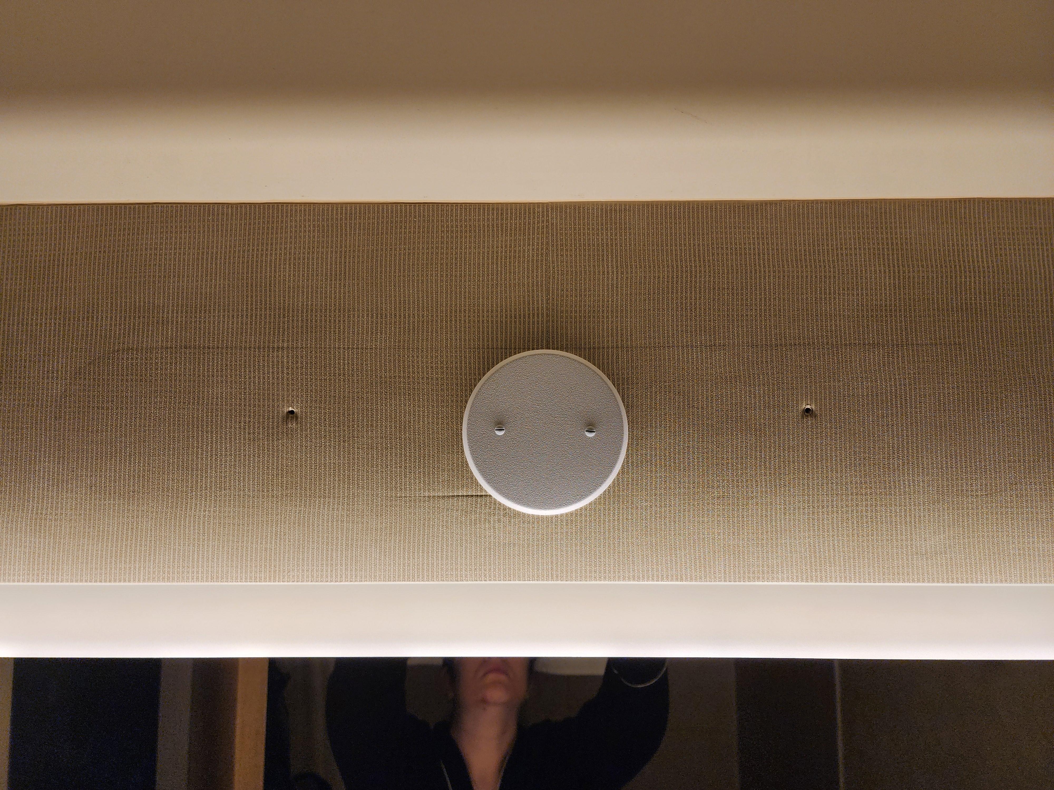 Bathroom light fixture removed with bare holes left.  The lighting was very dim.