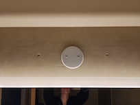 Bathroom light fixture removed with bare holes left.  The lighting was very dim.