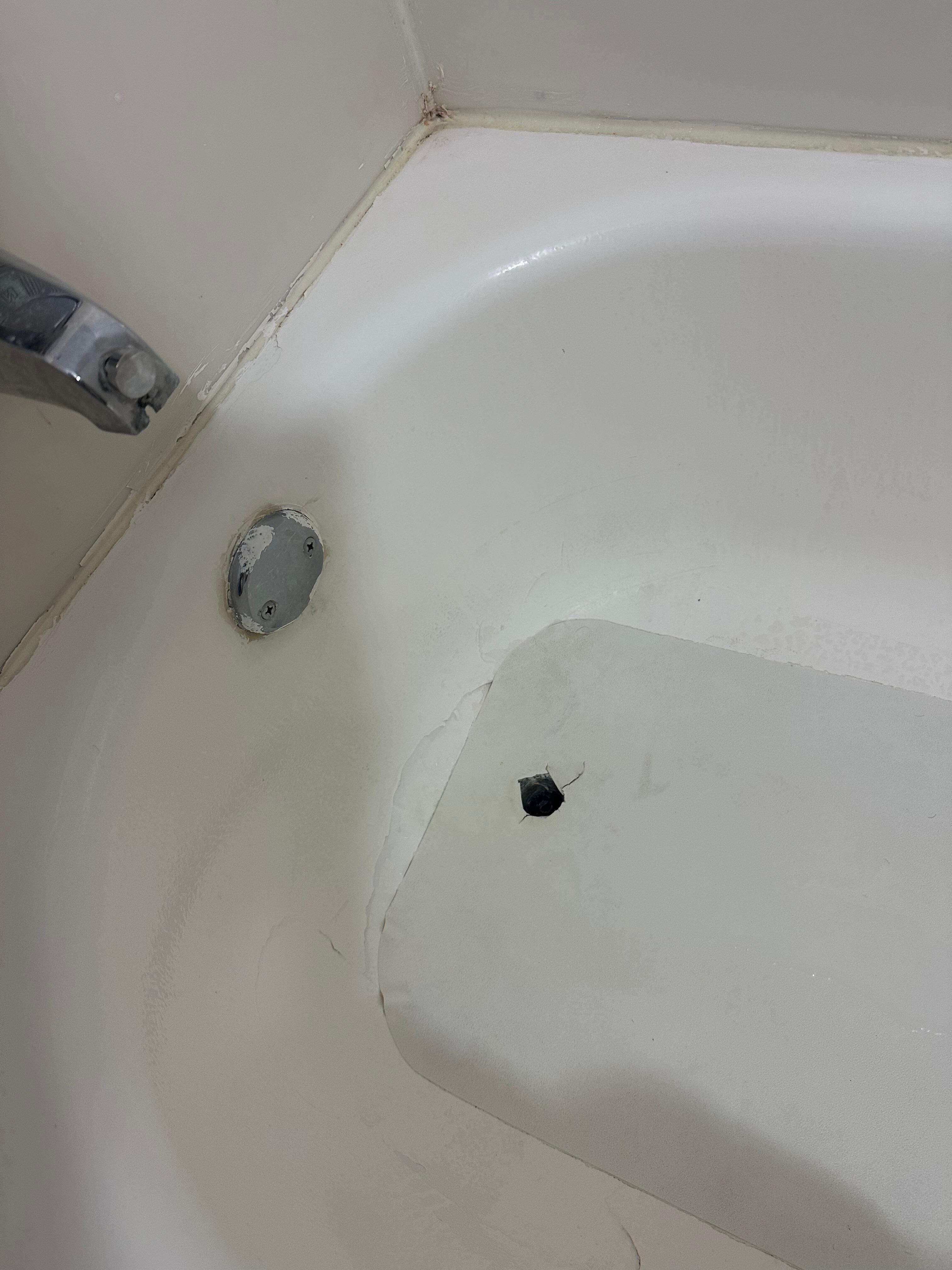 Shower mat was glued to the tub.