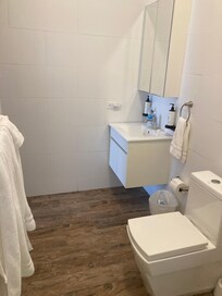 Sink with medicine cabinet and very nice toilet