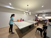 Family game of table tennis after dinner