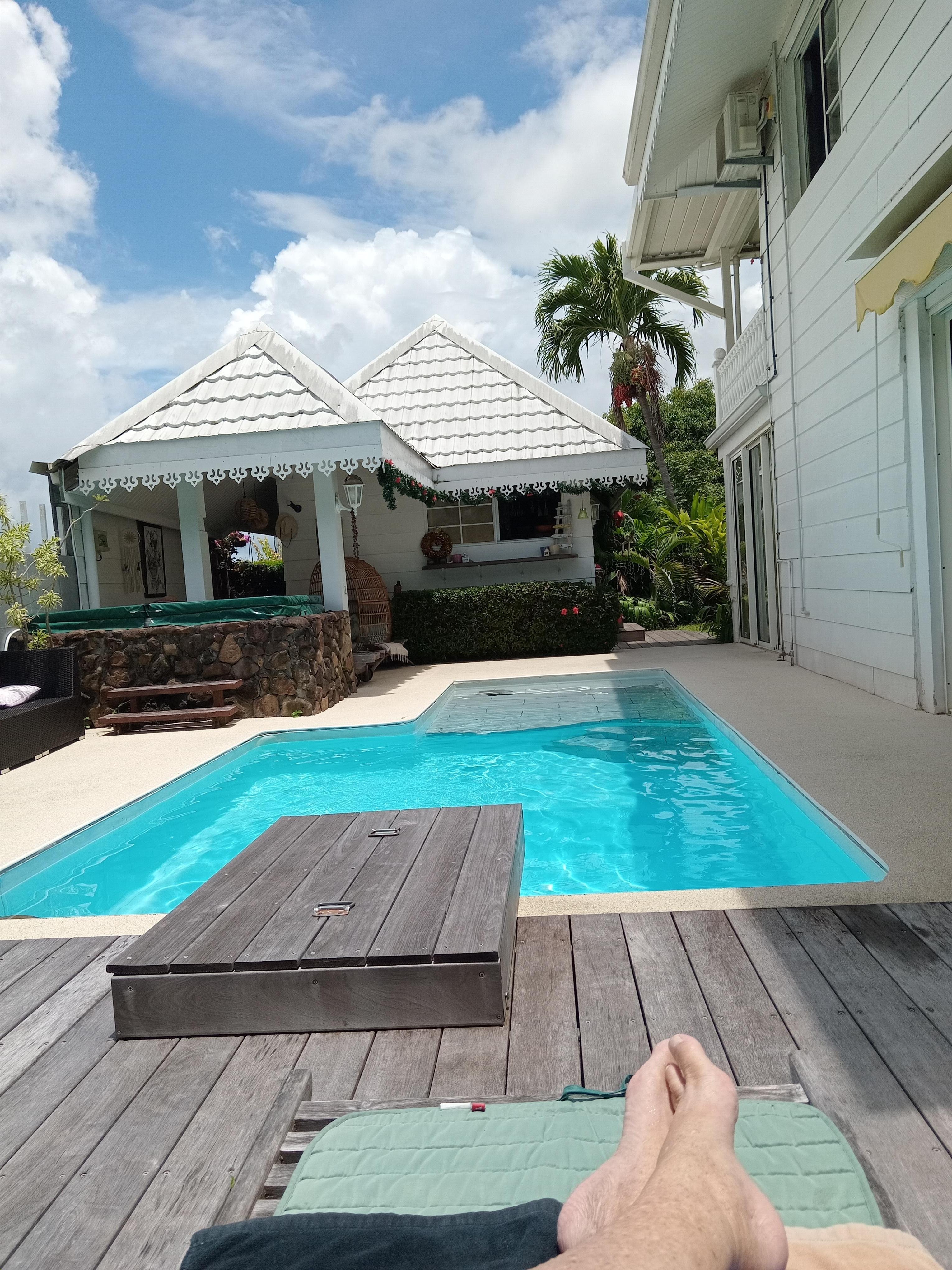 The pool house with kitchen and dining facilities for the guests and the pool.