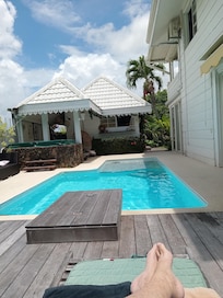 The pool house with kitchen and dining facilities for the guests and the pool.