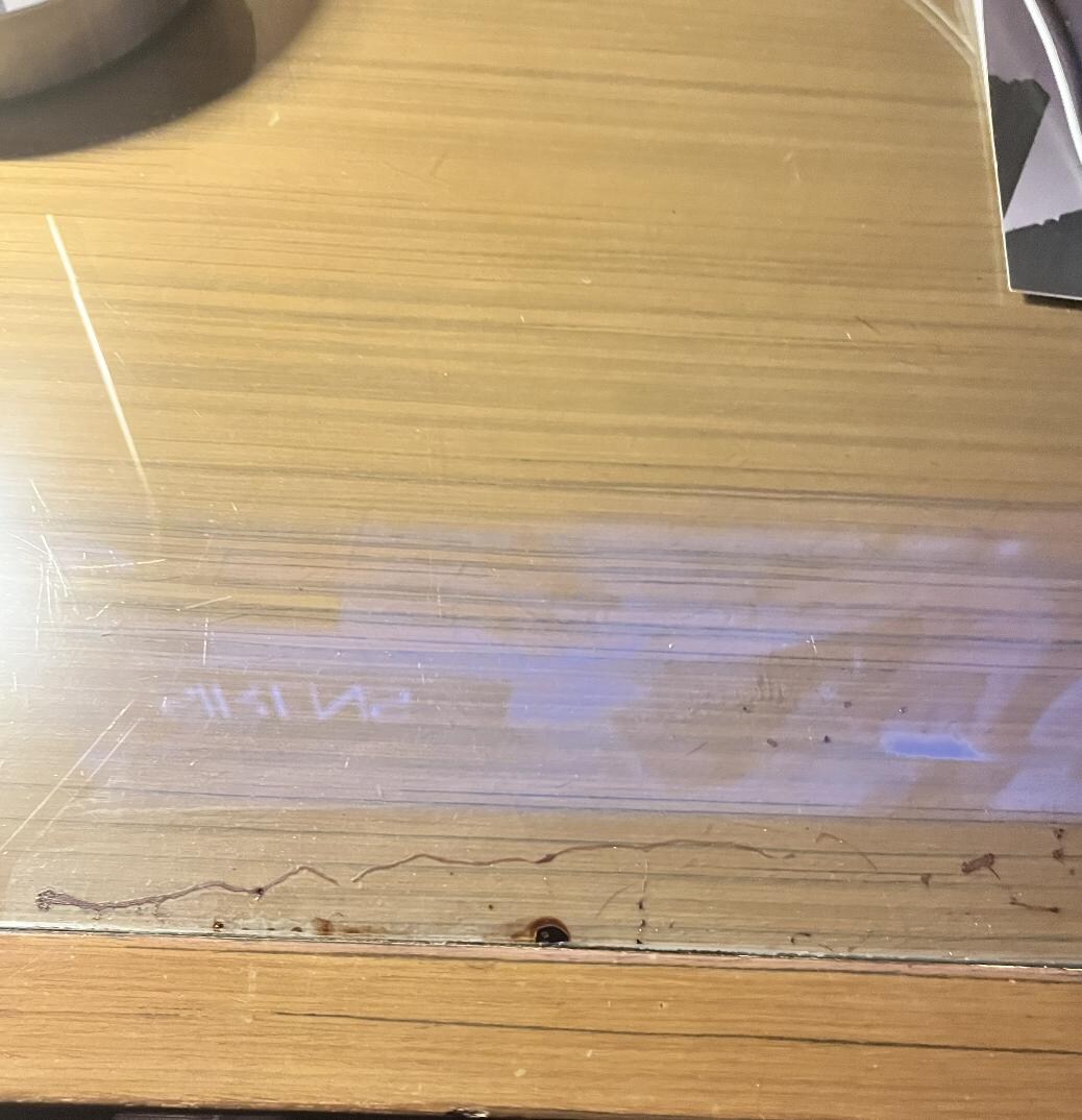 Old wine marks under the glass of the table