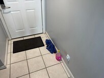 Cleaner left products and dirty bathroom towels in the unit